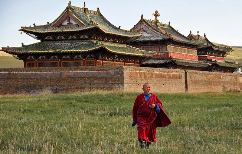 Monk walking Erdene Zuu monastery Mongolia